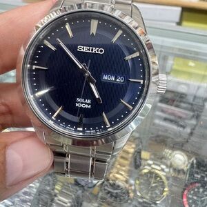 Seiko Silver and Blue Grooming Watch with Minimalist Design . Solar Power